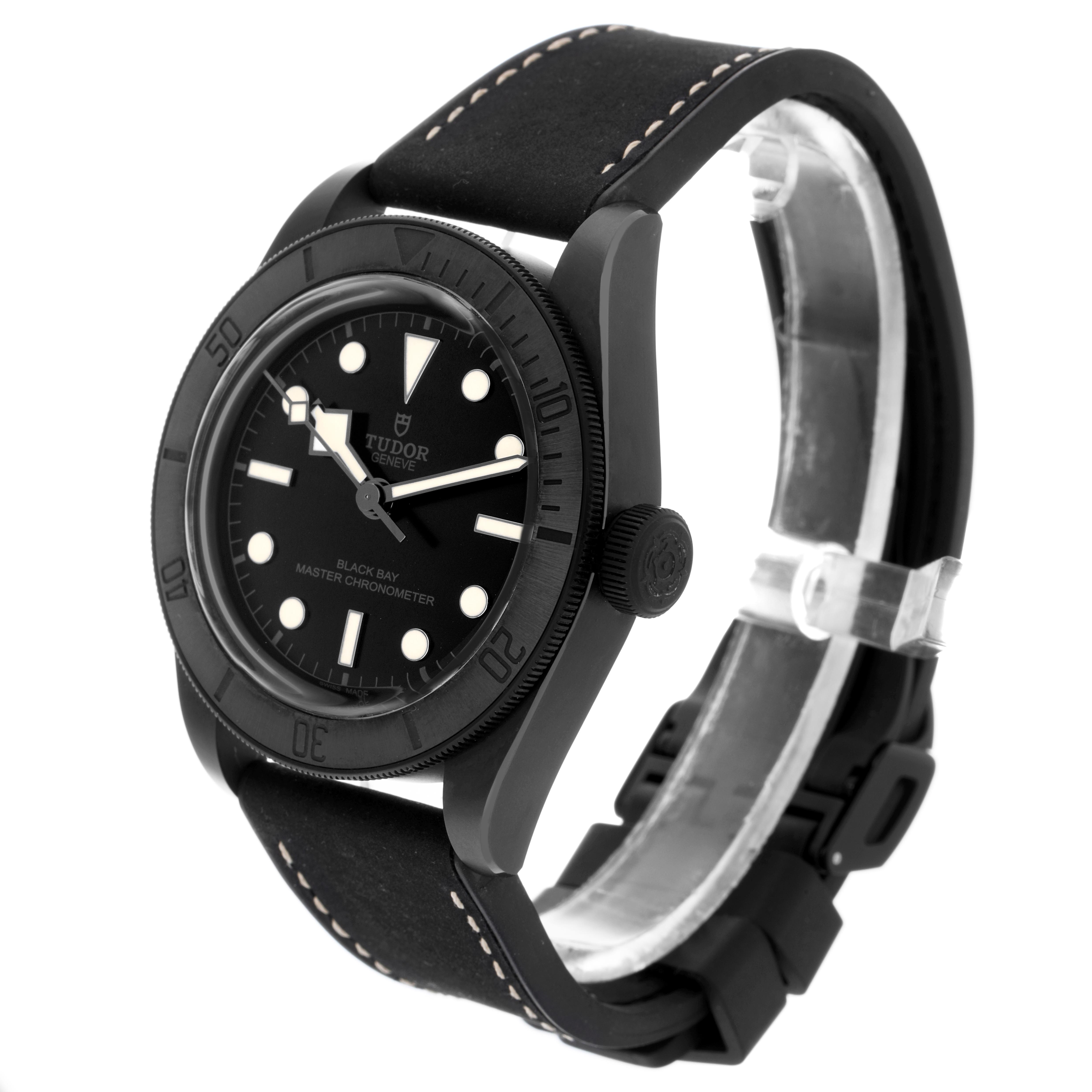 The Tudor Heritage Black Bay 79210 Men
s Ceramic Black Dial 79210 Men
s Ceramic Black Dial watch is shown from a front-side angle highlighting the face, bezel, crown, and strap.